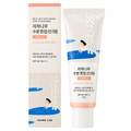 Round Lab Birch Juice Tone-Up Sonnencreme als beige Tube mit pfirsichfarbenem Rand neben der Faltschachtel